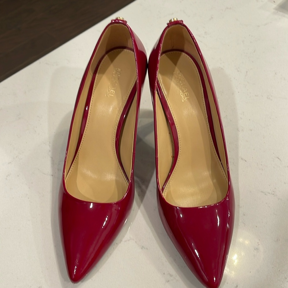 Red pumps by Michael Kors